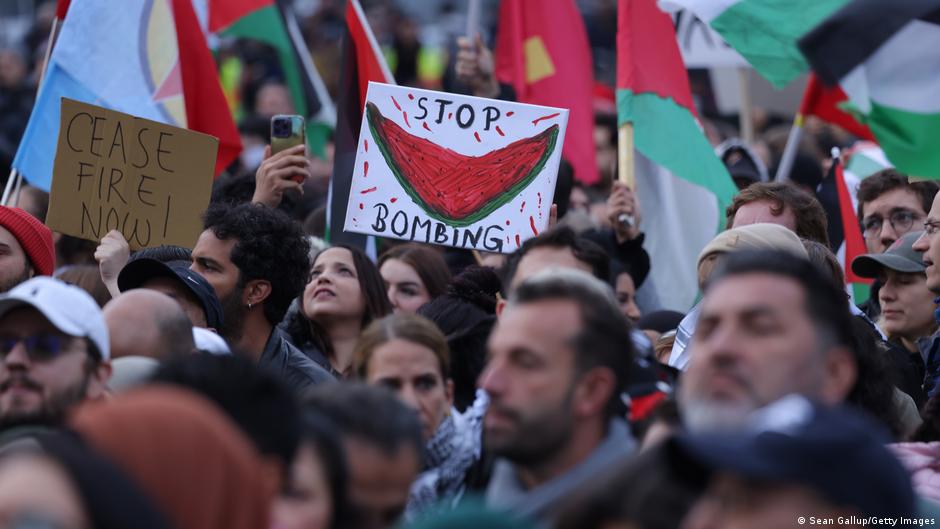 People wave Palestinian flags and hold a picture of a watermelon as they gather for a "Global South United" protest to demand freedom for Palestine in Berlin