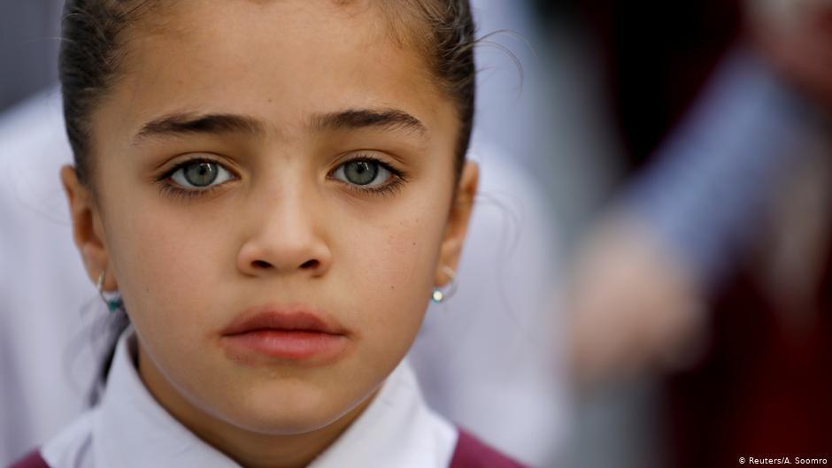 A Hazara girl attends an assembly prayer in Mariabad, Quetta (photo: Reuters/A. Soomro)