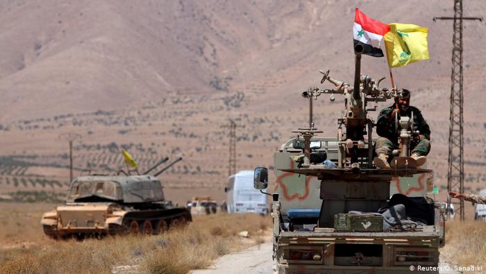 Hezbollah and Syrian flags in Qalamoun, Syria (photo: Reuters/O. Sanadiki)