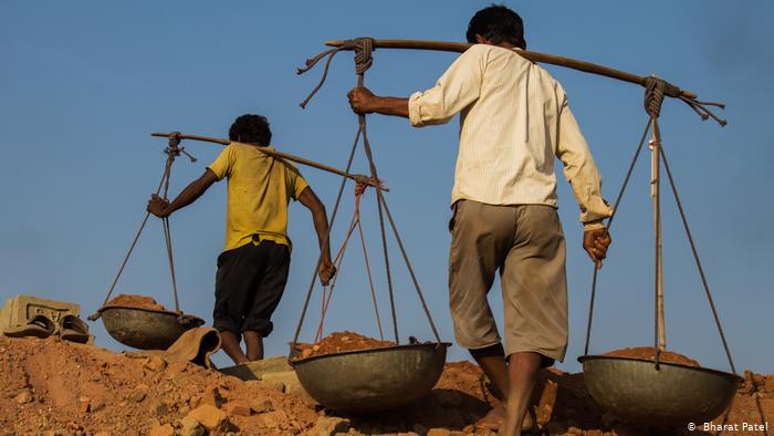 Men toiling in a mine