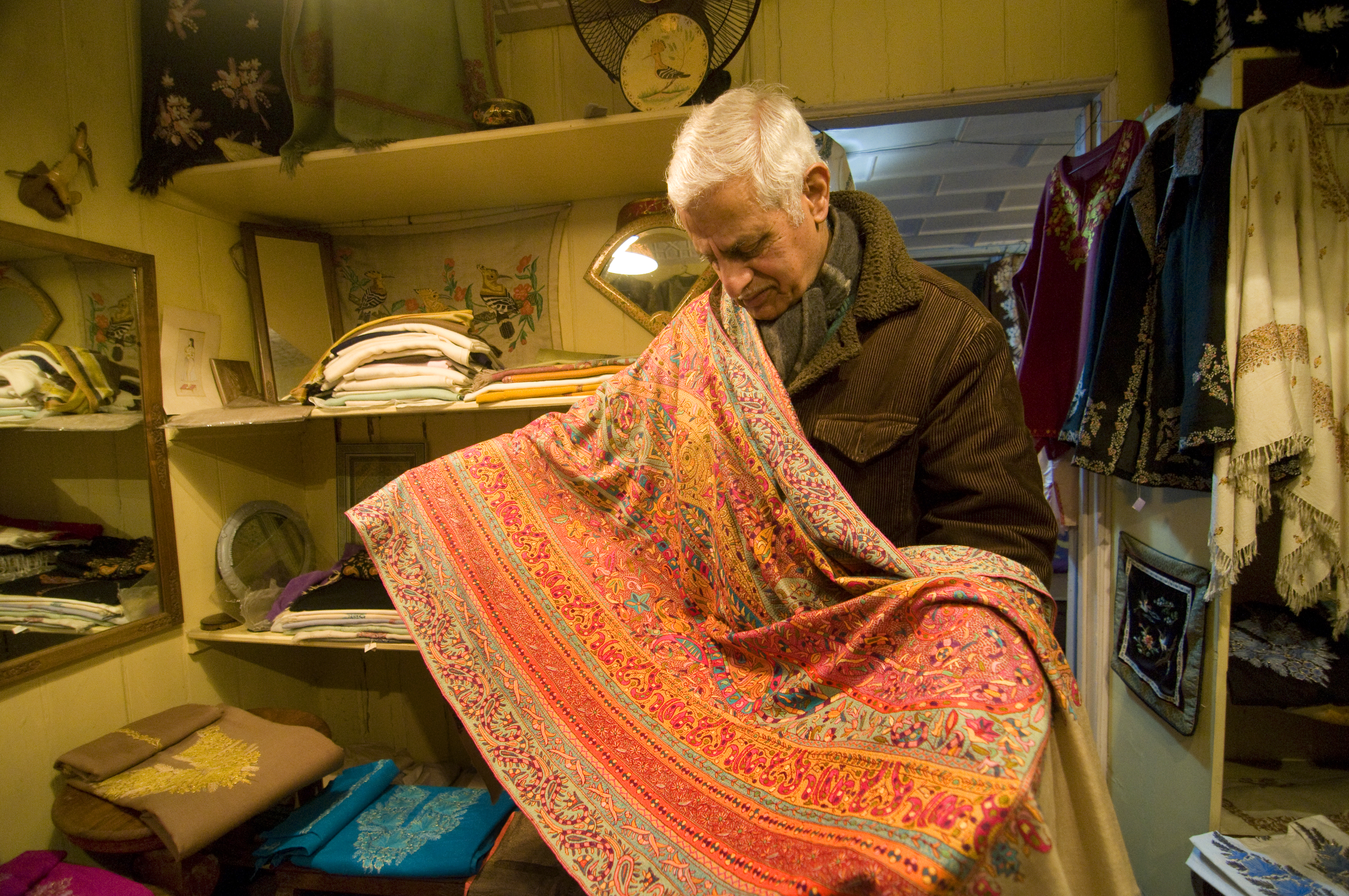 Sadiq Mohammed Wani displays a shawl made 85 years ago (photo: Sugato Mukherjee)