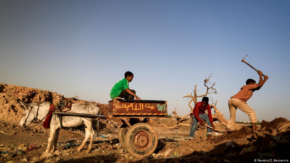 Mazeen, (right), aged 12, collects clay in an area known as the 'Potters Village' in Alqamayir, Omdurman, Sudan, 16 February 2020 (photo: REUTERS/Zohra Bensemra)