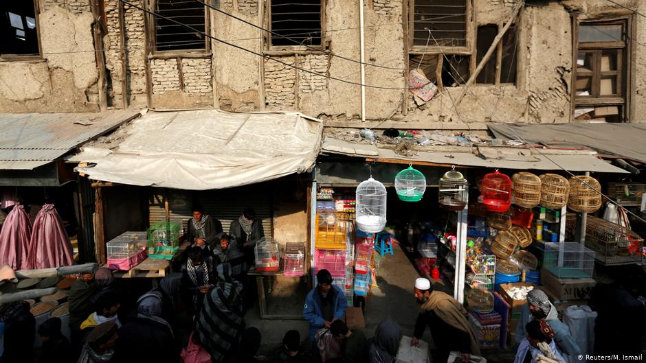 Afghan men walk at Ka Faroshi bird market in Kabul, Afghanistan (photo: REUTERS/Mohammad Ismail)