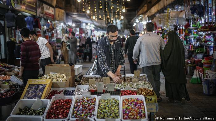 People at a market in Syria