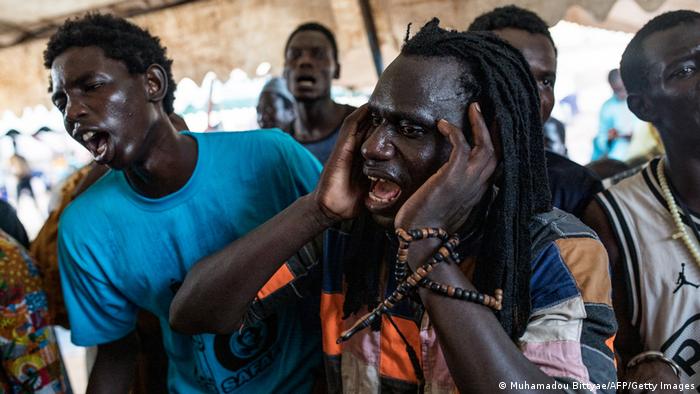 Members of the Mouride brotherhood recite prayers during the annual Muslim pilgrimage