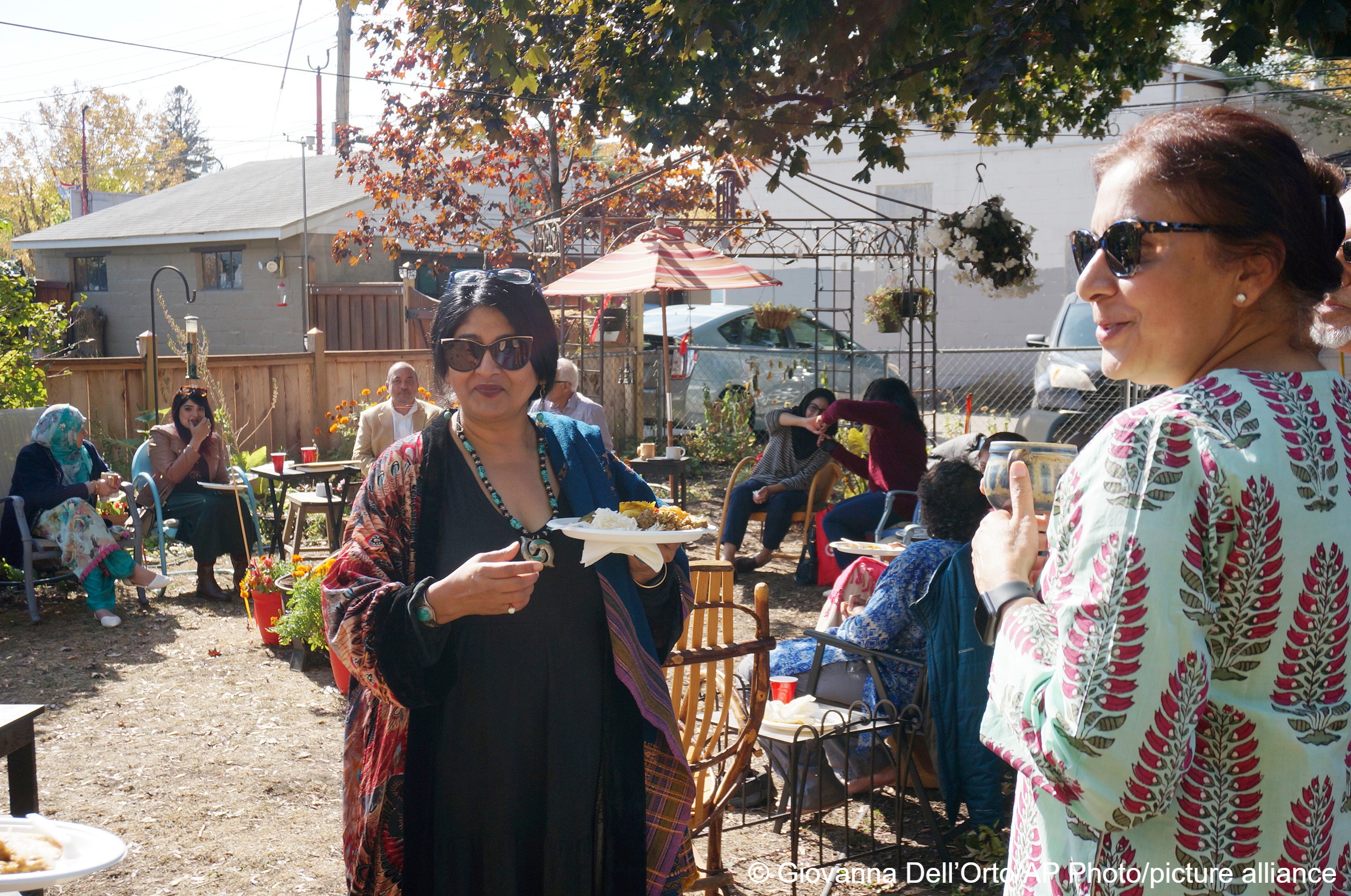 Kuhu Singh, left, and Kuljeet Kaur, right, gather at the Minneapolis house of two other members of the “India Coalition” group on 9 October 2022. Singh, who calls herself “culturally Hindu” and Kaur, who’s Sikh, both worry that religious tensions in India are spreading to Indian diaspora communities like theirs in Minnesota (photo: AP Photo/Giovanna Dell’Orto)