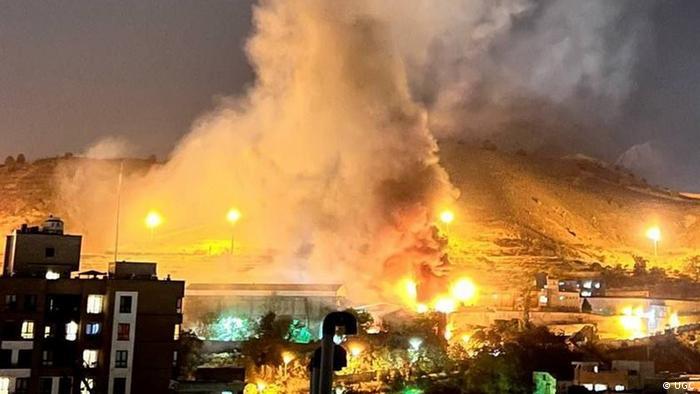 Fire and smoke are seen above Evin Prison in Tehran (photo: UGC)