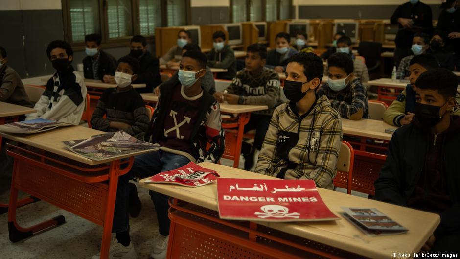 Middle school students attend an awareness lecture on the dangers of landmines and war remnants at a school in southern Tripoli, Libya (image: Nada Harib/Getty Images) 