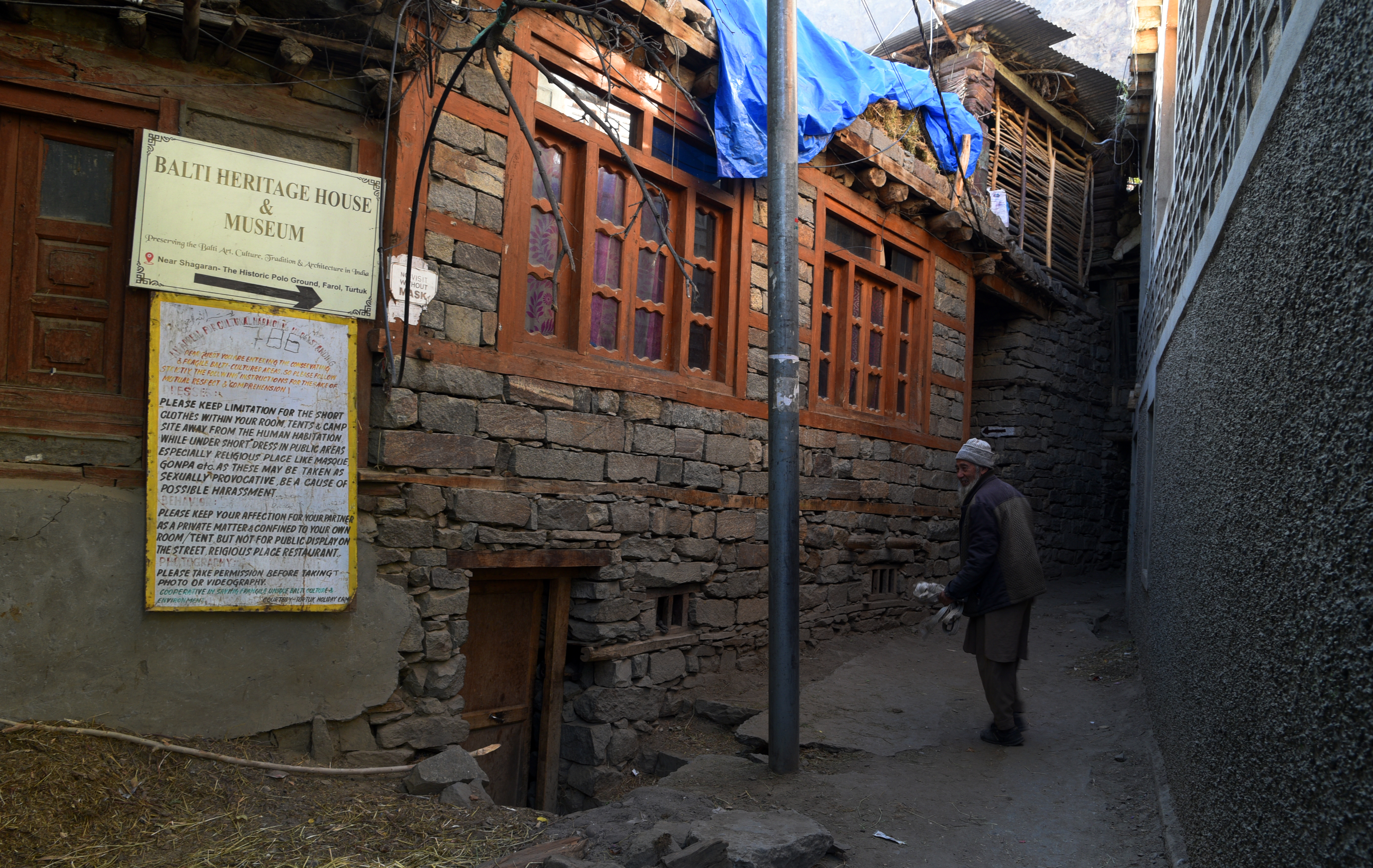 A man walks along an alley between buildings (image: Sugato Mukherjee)