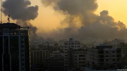 Smoke and dust rises above a densely populated area of Gaza City