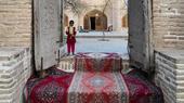 A girl waits on the threshold of the mausoleum of Sheikh Ahmad e-Jam in the north-east Iranian city of Torbat e-Jam