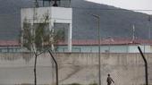 Exterior view of a prison in Turkey. A guard is on patrol.
