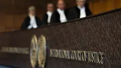 Judges enter the hall of the International Court of Justice