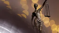A bronze statue of Justitia