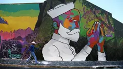 The Woodstock district of Cape Town, South Africa, is known for being hip and is one of the best street art locations in South Africa. Here, a wall painting shines with all its colours and grace in the multicultural neighbourhood.